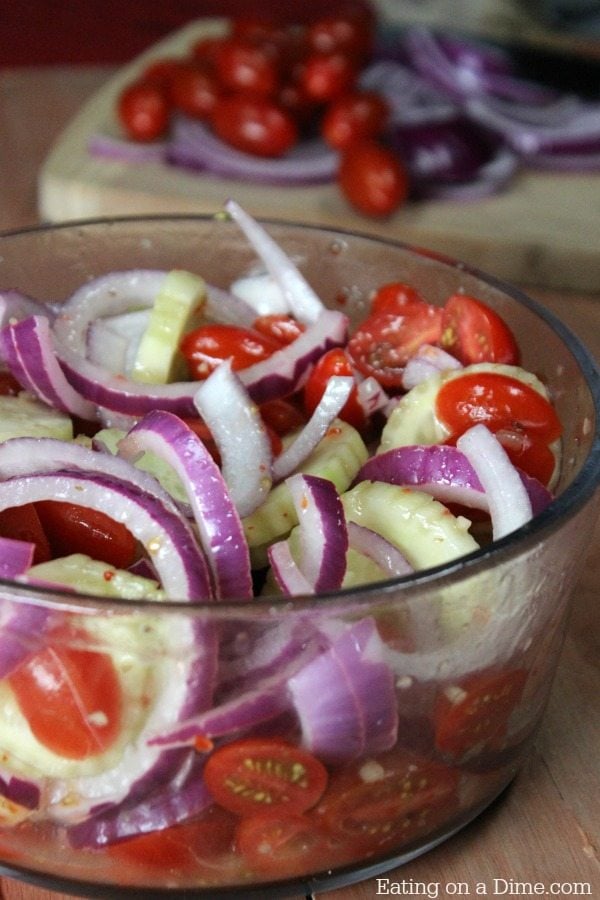 preparing cucumber and tomato salad