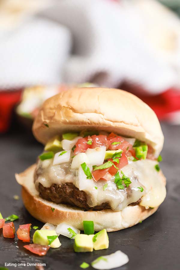 Grilled Taco Burger is a tasty twist on a traditional burger with lots of Mexican flavor, pico de gallo and melted cheese. Try Grilled Taco Burger Recipe.