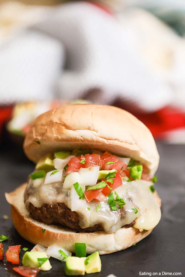 Grilled Taco Burger is a tasty twist on a traditional burger with lots of Mexican flavor, pico de gallo and melted cheese. Try Grilled Taco Burger Recipe.