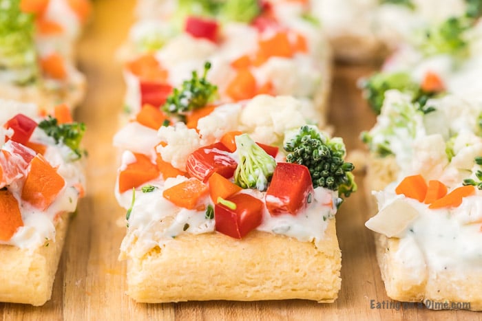 slices of veggie pizza on a cutting board