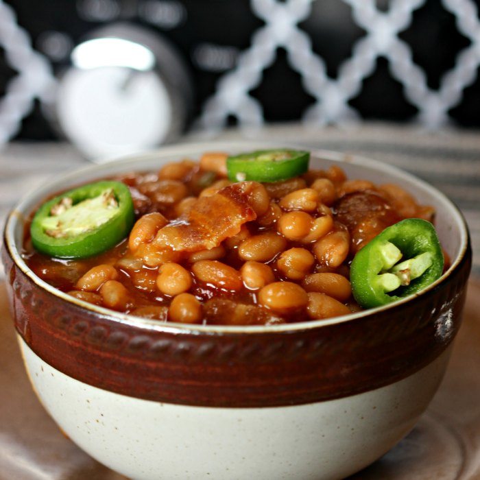 This crock pot baked beans recipe with bacon is amazing! It is the best baked beans recipe in the slow cooker you can make and it’s easy too! I love making this recipe for a crowd. If you love slow cooker easy recipes, you are going to love this beans with bacon crockpot recipe! #eatingonadime #crockpotrecipes #sidedishes 