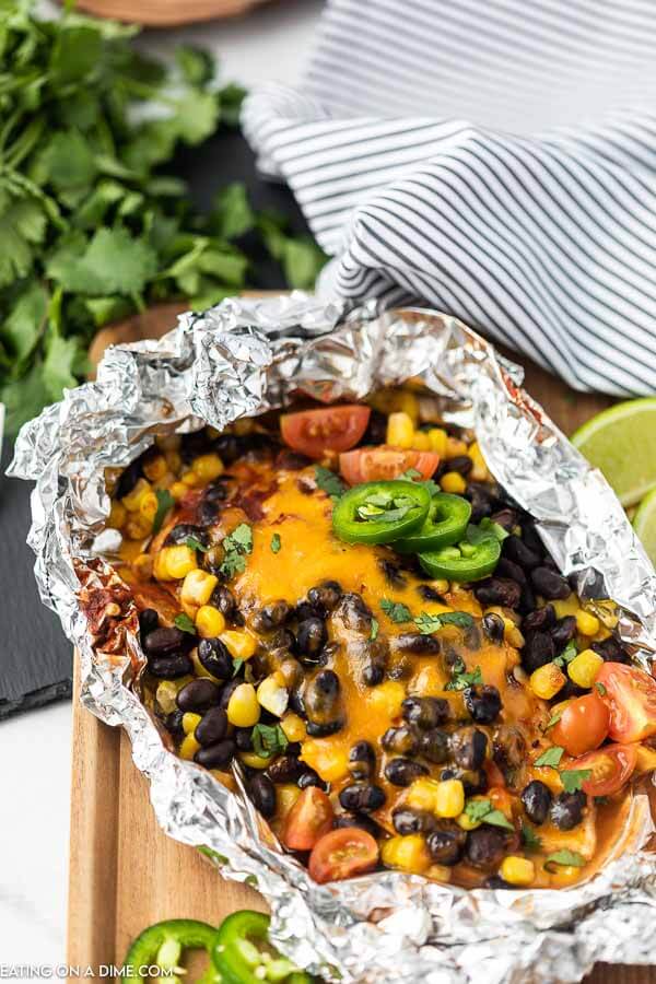 Santa fe Chicken foil pack has everything you need for a great dinner. Cheesy chicken, black beans, corn and even rice!