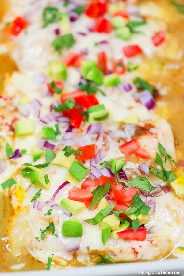 Try this easy low carb recipe, Baked Enchilada Chicken with green enchilada sauce. Enjoy all the flavor of chicken enchilada bake in this low carb version. Try keto baked enchilada chicken today! You won’t believe that it’s healthy when you taste it! #eatingonadime #ketorecipe 
