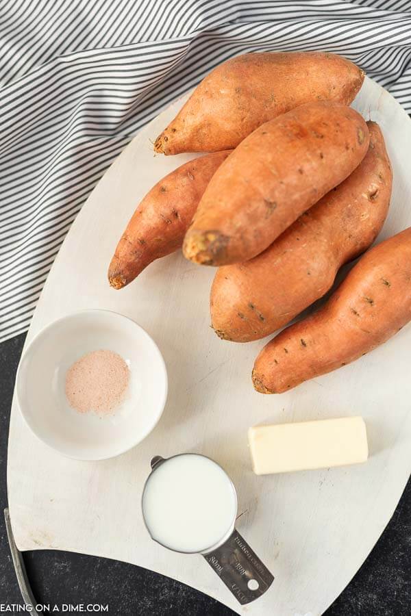 Photo of ingredients for mashed sweet potatoes: butter, milk, salt, sweet potatoes.