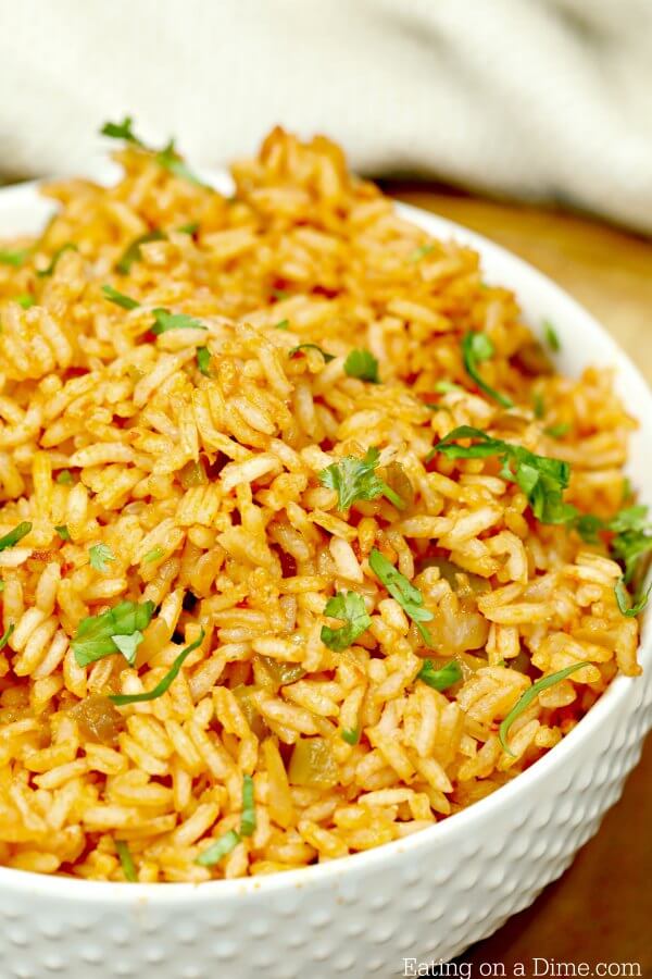 Close up of Spanish rice in a white bowl.  