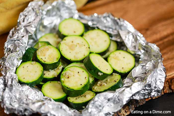 Grilled Zucchini Foil Pack Recipe is the easiest side dish and clean up is a breeze.  The veggies have the best flavor from the grill and it is so frugal.