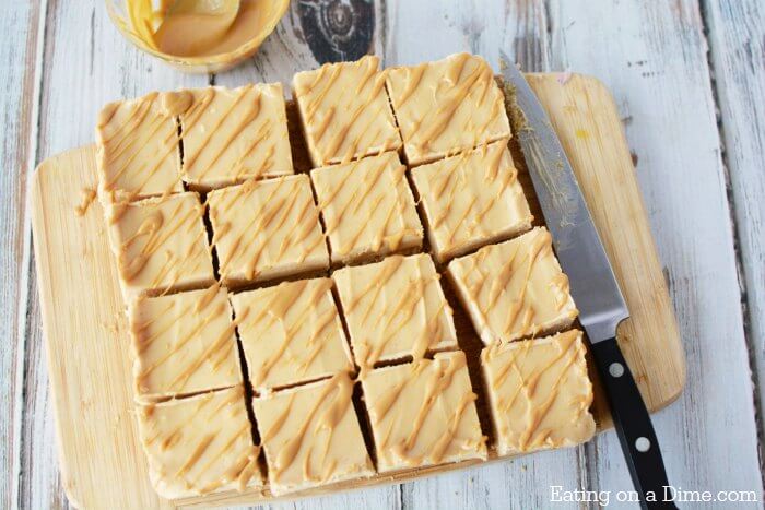 Peanut Butter Cheesecake Recipe will be a hit. Try Easy Peanut Butter Cheesecake Bites Recipe. Mini Peanut Butter Cheesecake bars make the perfect dessert! Everyone will love these easy to make cheesecake bites! #eatingonadime #dessertrecipes #cheesecakerecipes 