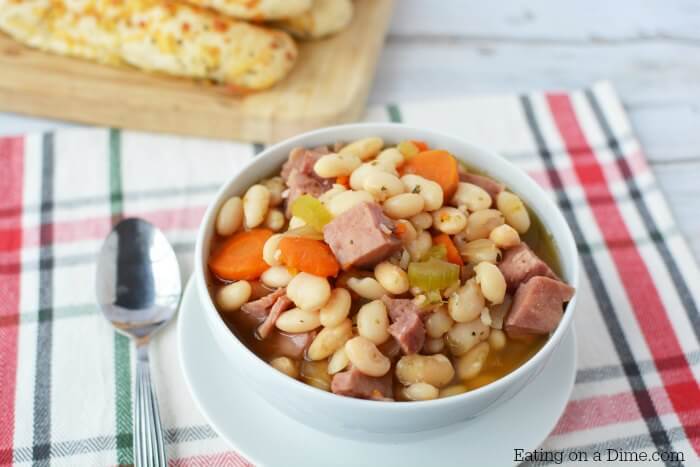 Try this hearty ham and bean soup crock pot recipe. Slow Cooker ham and bean soup is quick and easy. Crock pot ham and beans will be a hit with the family!