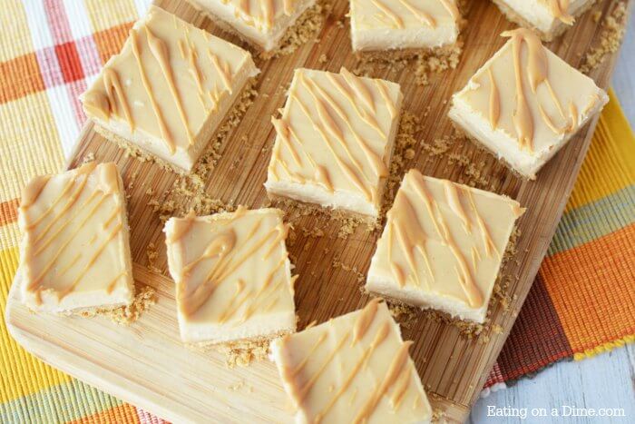 Peanut Butter Cheesecake Recipe will be a hit. Try Easy Peanut Butter Cheesecake Bites Recipe. Mini Peanut Butter Cheesecake bars make the perfect dessert! Everyone will love these easy to make cheesecake bites! #eatingonadime #dessertrecipes #cheesecakerecipes 