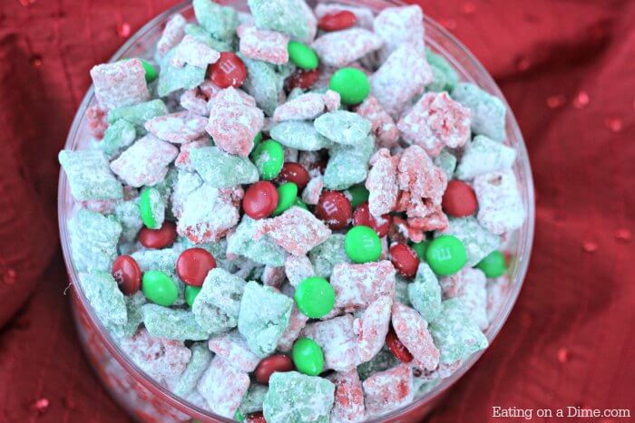 This quick and easy Christmas Puppy Chow Recipe will be a hit! The red and green puppy chow chex is so festive. You will love Chex Mix Muddy Buddies! 