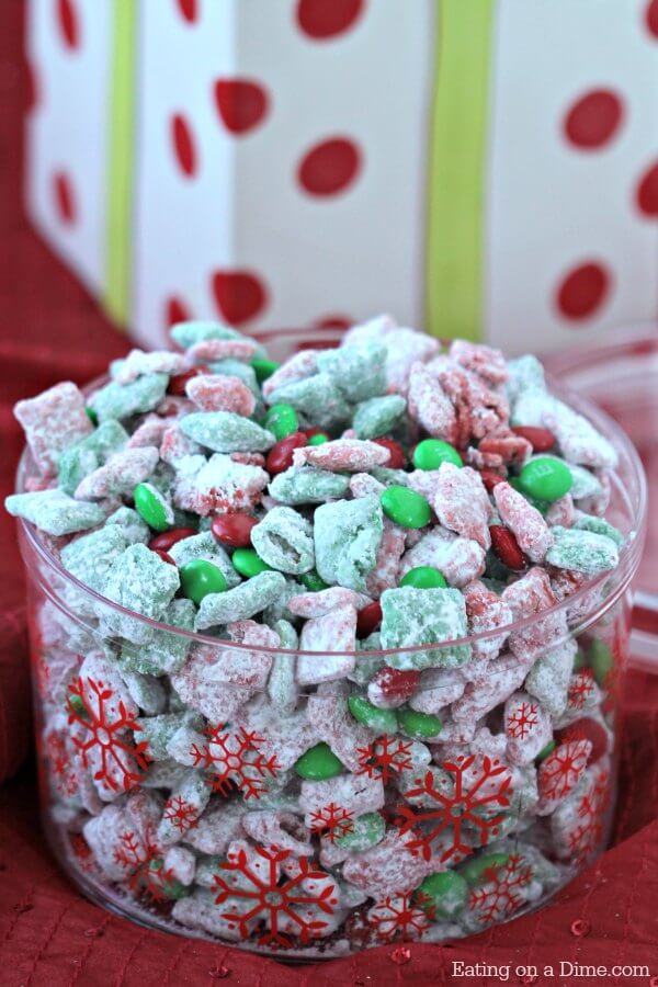This quick and easy Christmas Puppy Chow Recipe will be a hit! The red and green puppy chow chex is so festive. You will love Chex Mix Muddy Buddies! 