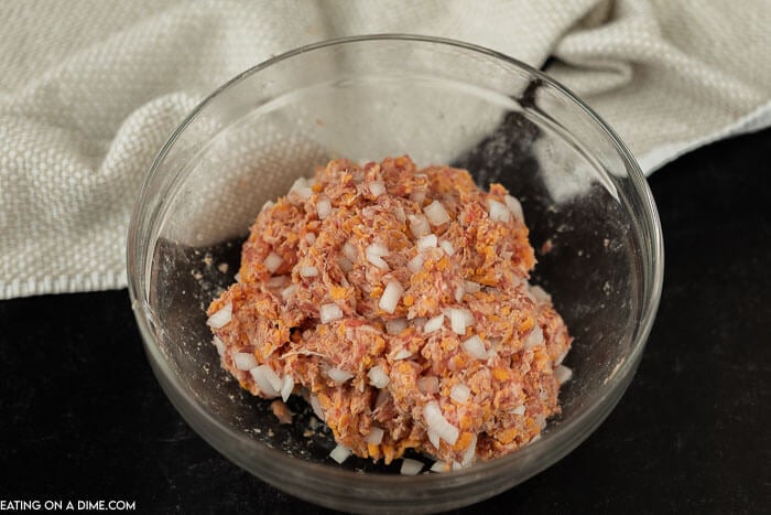 Close up image of ingredients of sausage balls in the mixing process. 