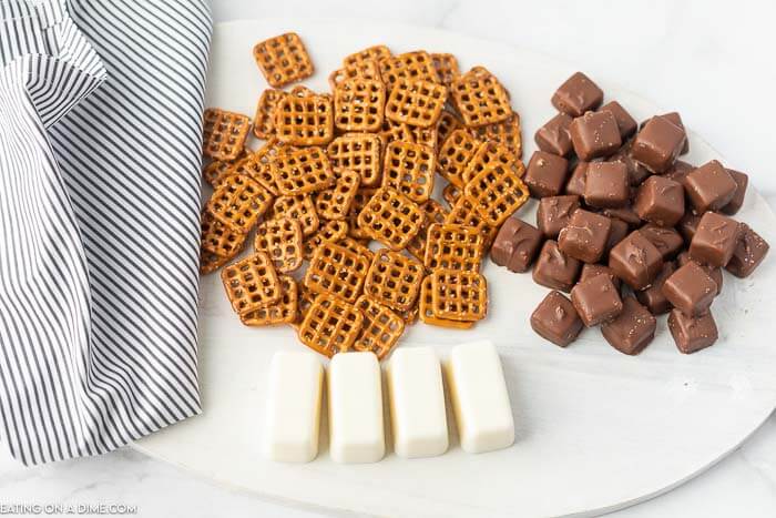 Snicker chocolate pretzels are the perfect combination of salty and sweet in a bite size treat. If you need an easy dessert, try this!