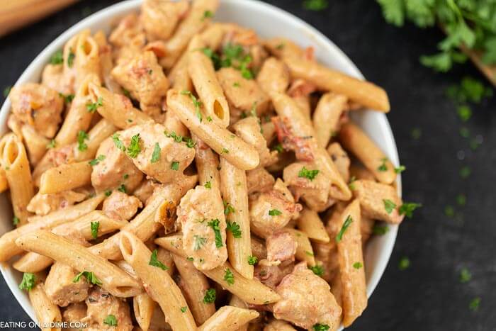 Cajun Chicken Pasta in a white bowl on a black platter 