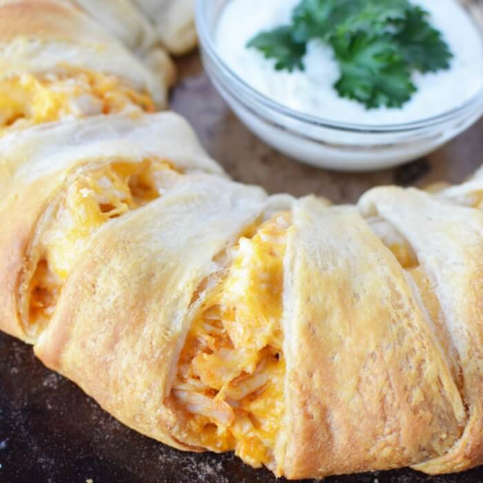 Close up Buffalo Chicken Crescent Ring with a ranch dip