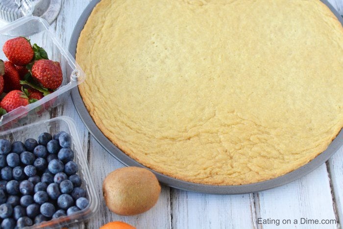 Close up image of sugar cookie crust with fresh strawberries and blueberries. 