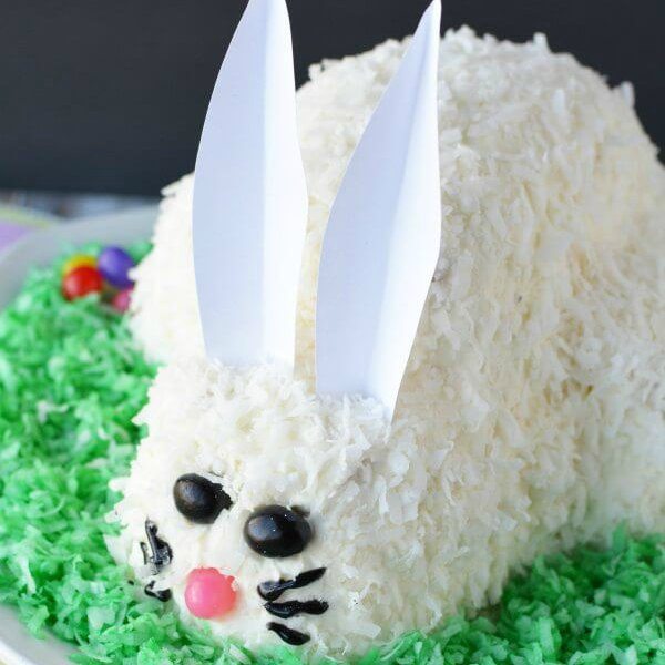 This adorable Easter Bunny Cake will be a hit! You will love how simple this easy bunny cake is. The flaky coconut and jelly beans come together to make this bunny cake recipe so cute! Try this Easter cake recipe! We love easy Easter cakes! 