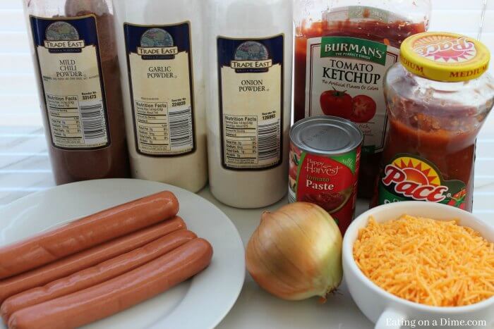 Ingredients needed - ground beef, ketchup, hot dogs, salsa, onion powder, tomato paste, garlic powder, chili powder, hot dog buns, onions, cheddar cheese, mustard