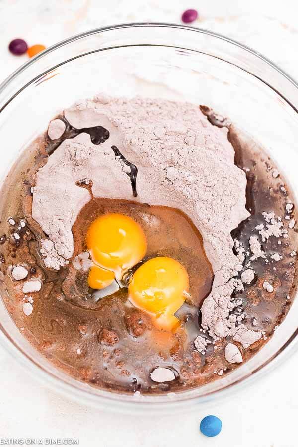 Mixing the brownie ingredients in a large bowl