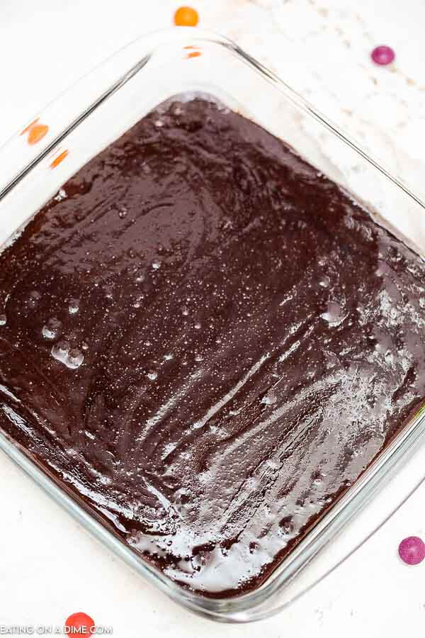 Pouring the cosmic brownie batter in a baking dish