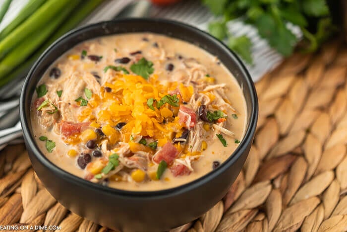 Creamy chicken taco soup in a black bowl