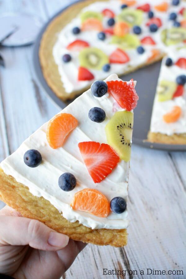 Close up image of a fruit pizza sliced. 