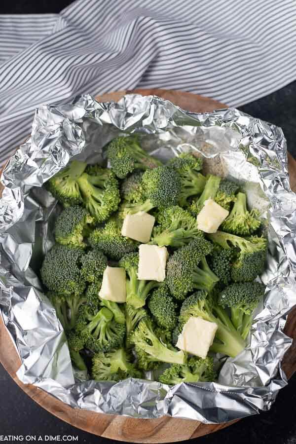 broccoli and butter in foil going on grill
