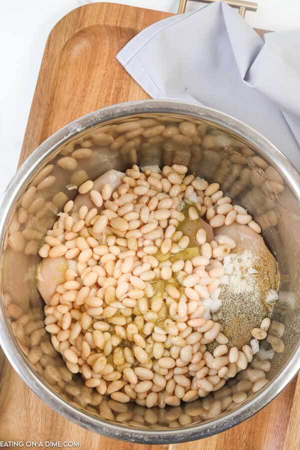 Close up image of the ingredients for white chicken chili in the instant pot. 