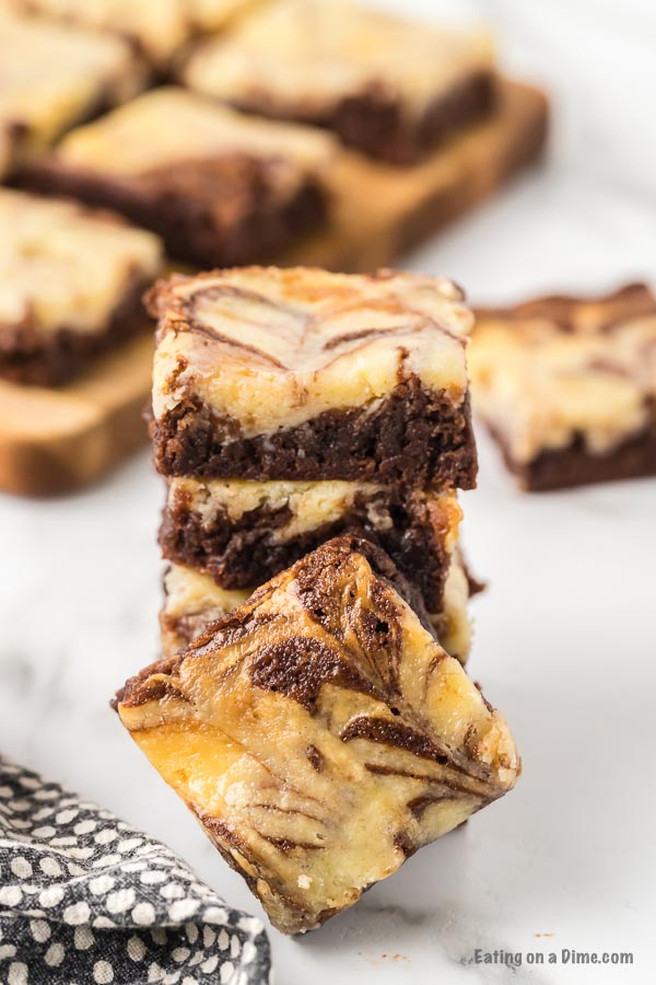 Close up image of cheesecake brownie stacked. 