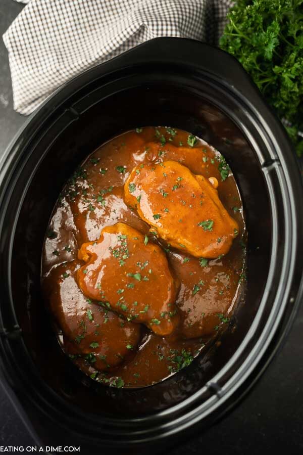 the best crock pot pork chops in a black crock pot 