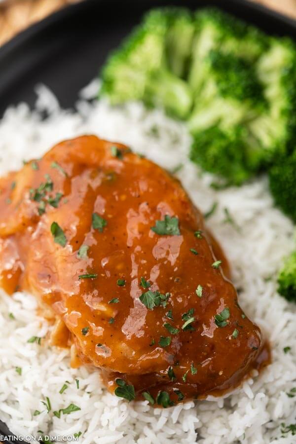 BBQ Pork chops over white rice with steamed broccoli 