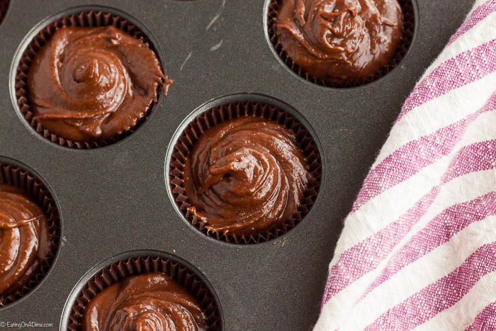 Close up image of brownie batter in muffin tins. 