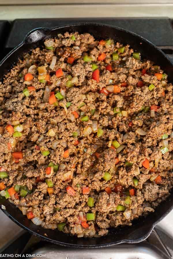 The philly cheesesteak sloppy joe meat mixture in a large cast iron pan 