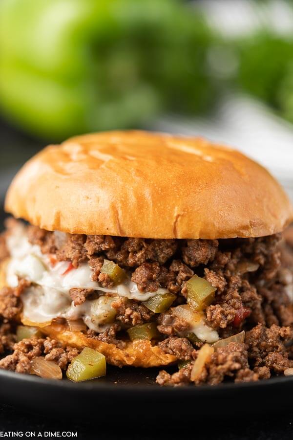 Close up of a Philly Cheesesteak Sloppy Joes on a black plate 
