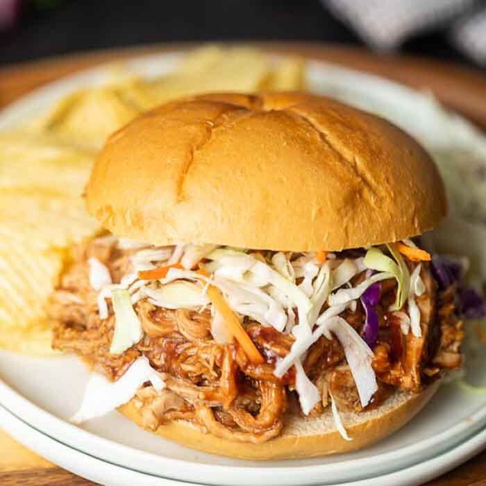 Close-up of a pulled pork sandwich.  