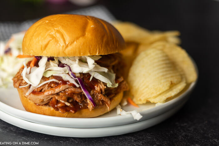 Instant pot pulled pork recipe is a quick and easy dinner idea! There is lots of tender pork packed with flavor piled high on a fluffy roll! 