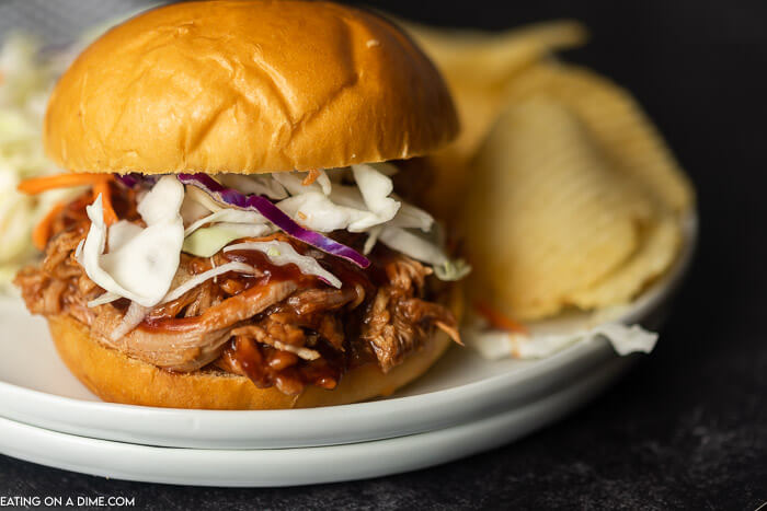 Instant pot pulled pork recipe is a quick and easy dinner idea! There is lots of tender pork packed with flavor piled high on a fluffy roll! 