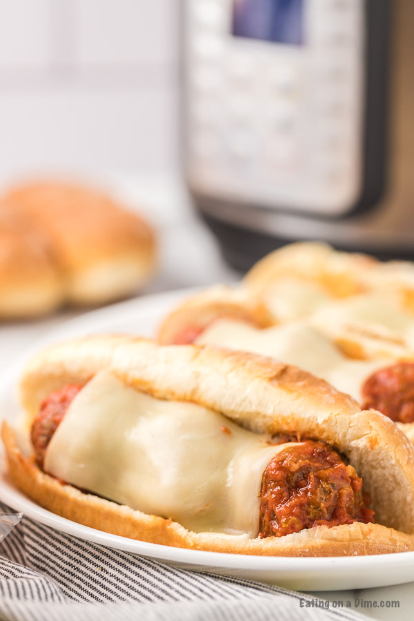 Close up image of meatball subs on a plate. 