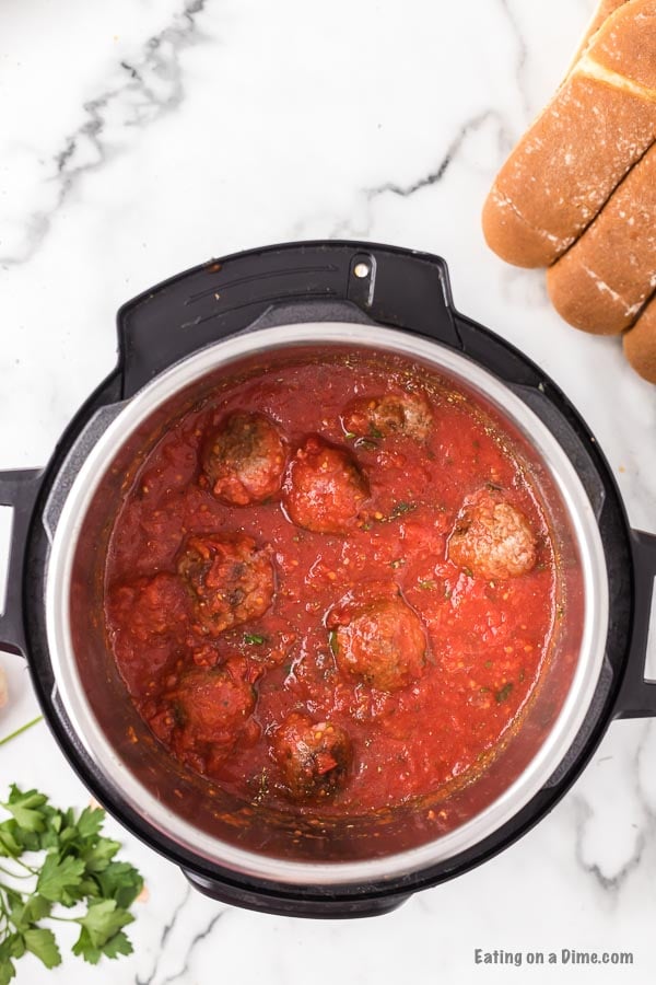 Close up image of meatball mixture in an instant pot. 
