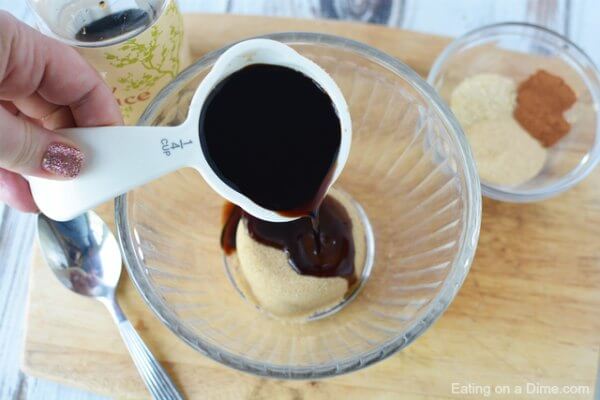 Pour soy sauce in a bowl with brown sugar