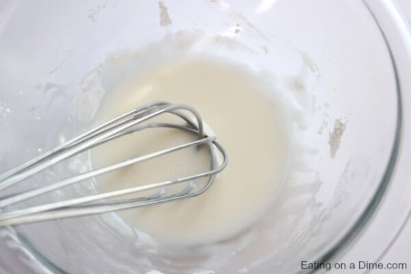 Bowl with whisk and glaze. 