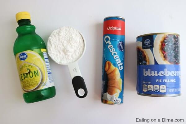 Ingredients for recipe: lemon juice, powdered sugar, crescent rolls and blueberry pie filling. 