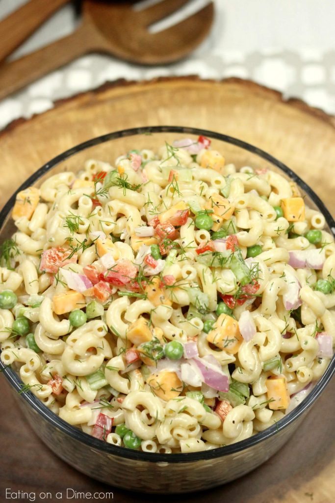Overview of this Macaroni Pasta Salad in a large bowl topped with fresh dill. 