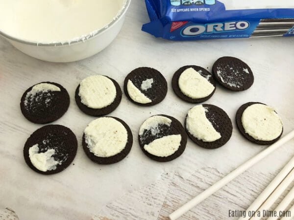Each Oreo opened and laid out on a counter top. 