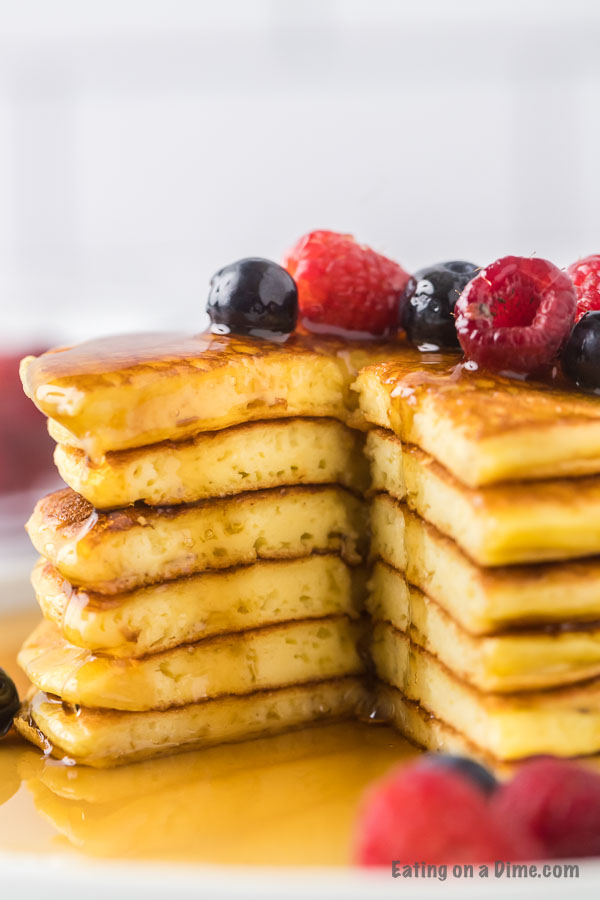 stack of pancakes sliced on plate