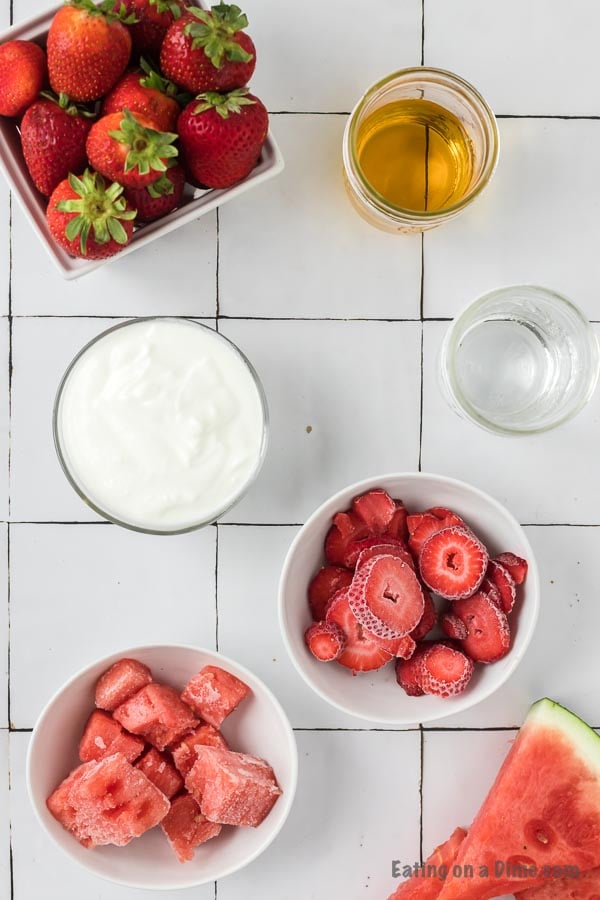 Close up image of the ingredients to make watermelon strawberry smoothie. 