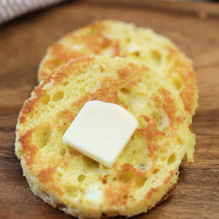 Close up 2 pieces of 90 second bread toasted and topped with butter.  