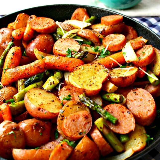 Do you need a simple dinner idea? Oven Roasted Potatoes & Sausage Sheet Pan Dinner is a complete meal in one pan. Clean up is easy and the meal is so tasty.