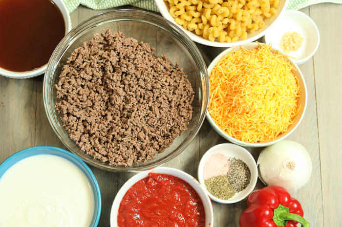 Ingredients for recipe: ground beef, cheese, pasta, seasoning, crushed tomatoes, onion, bell pepper, milk. 