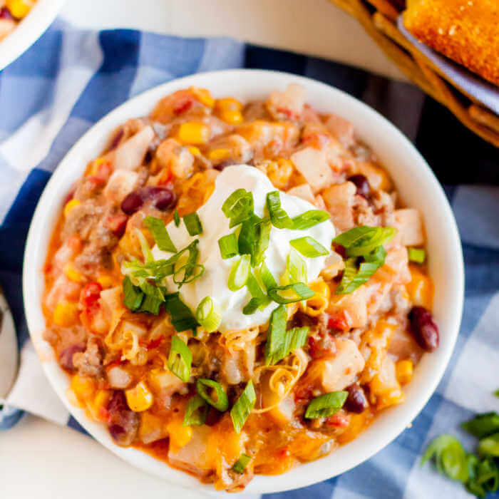 Crockpot Cowboy Casserole has all you need for an easy meal in the slow cooker. Each bite of Cowboy casserole crock pot recipe is loaded wtih flavor. Crockpot Cowboy Casserole Recipe has everything you need for a tasty meal. Packed with flavorful ground beef, hearty beans, cheese and more!